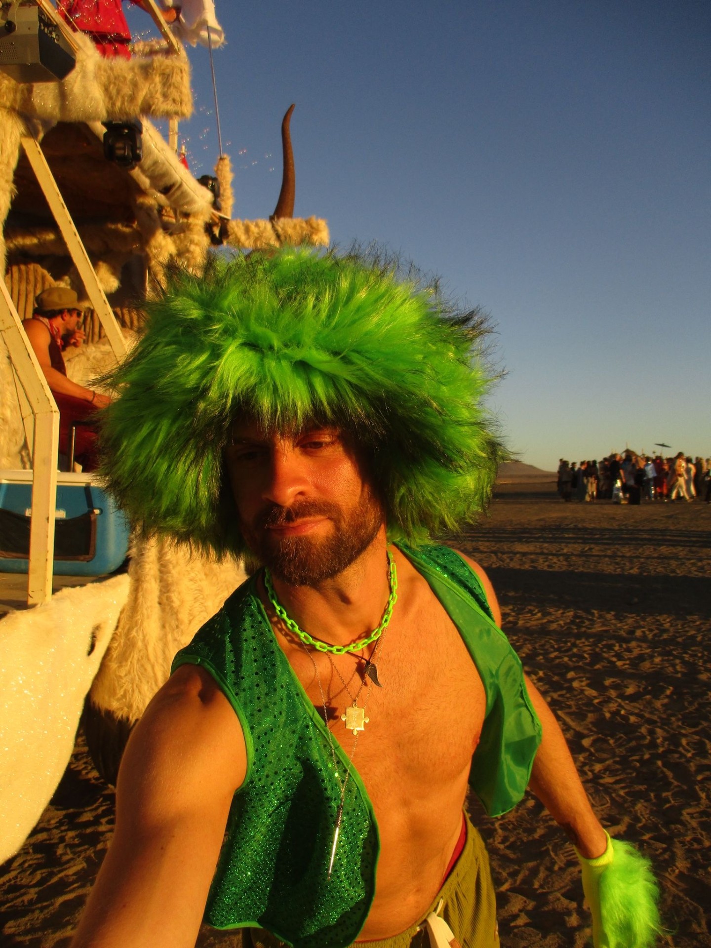 Erik — founder of Rambazamba Industries, in a green wig on the playa at AfrikaBurn